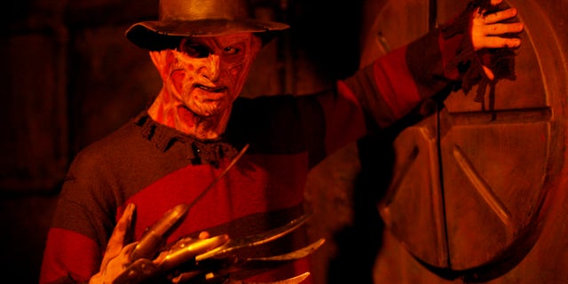A man dressed as Freddie Krueger stands inside the Blood Manor in New York October 30, 2008. Blood Manor is a haunted attraction that is comprised of 5,000 square feet of themed corridors and passageways. REUTERS/Shannon Stapleton (UNITED STATES) - RTXA3EL