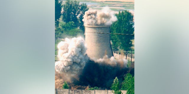 A cooling tower is demolished at a North Korean nuclear plant in Yongbyon in 2007.
