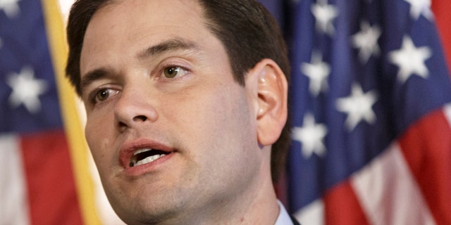 FILE - In this Jan. 8, 2014 file photo, Sen. Marco Rubio, R-Fla. speaks on Capitol Hill in Washington. This is a year of auditioning, positioning, networking and just plain hard work for people who are considering running for president in 2016. You could see them stirring in 2013 as they plugged holes in resumes, took preliminary steps to build potential campaign organizations and made carefully calibrated moves to get better known by Americans generally and key constituencies in particular. Most _ but not all _ are ticking off items on what could be called the presidential prep checklist. And theyâve got baggage to deal with. (AP Photo/J. Scott Applewhite, File)
