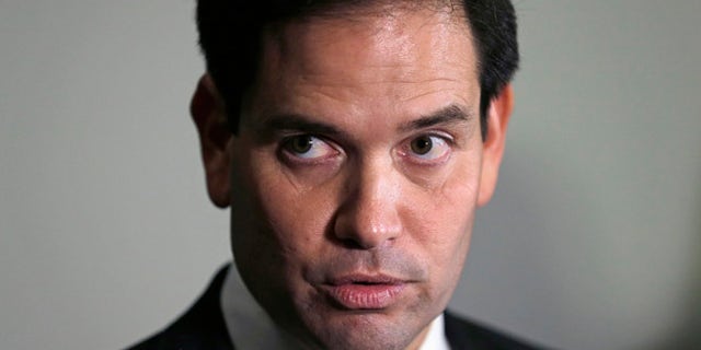 Republican presidential candidate Sen. Marco Rubio, R-Fla. answers a reporter's question after a campaign event at Saint Anselm College in Manchester, N.H., Wednesday, Nov. 4, 2015. (AP Photo/Charles Krupa)
