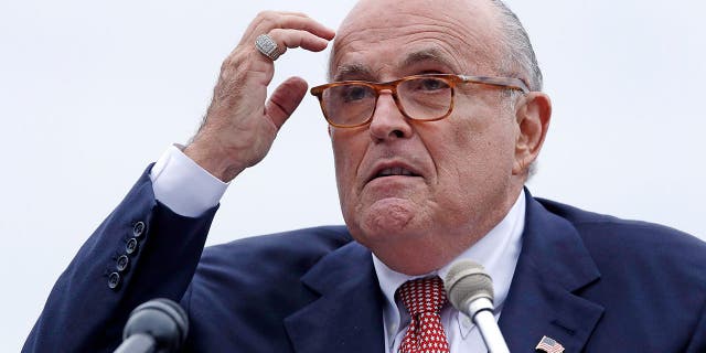 FILE - In this Aug. 1, 2018 file photo, Rudy Giuliani, an attorney for President Donald Trump, addresses a gathering during a campaign event for Eddie Edwards, who is running for the U.S. Congress, in Portsmouth, N.H. President Donald Trump will not answer any questions, written or in-person, about possible obstruction of justice, Giuliani told The Associated Press. Giulianiâs statement was the most definitive rejection yet of Special Counsel Robert Muellerâs efforts to interview the president about any efforts to block the investigation into possible coordination between his campaign and Russians. (AP Photo/Charles Krupa, File )<br>