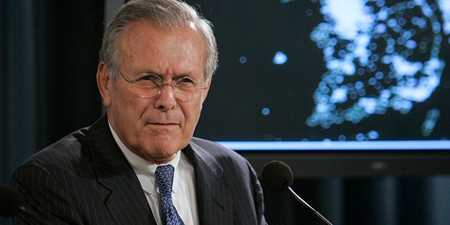 With a map of the Korean Peninsula behind him, Defense Secretary Donald H. Rumsfeld gestures during a press briefing at the Pentagon, Wednesday, Oct. 11, 2006. (AP Photo/Evan Vucci)