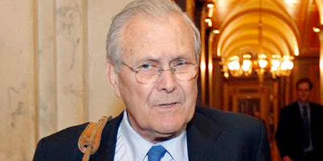 Former Defense Secretary Donald Rumsfeld talks with a reporter on Capitol Hill May 3.