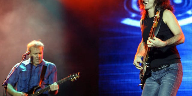 Canadian rock band Rush singer/bassist Geddy Lee (R) and guitarist Alex
Lifeson perform during a sold-out show at Morumbi stadium in Sao Paulo,
November 22, 2002. The Canadian rock trio is touring for the first time
in Brazil in support of 'Vapor Trails,' the band's first studio album
since 1996. REUTERS/Paulo Whitaker
PW/HB - RTR154XH