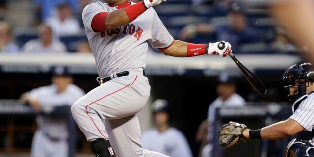 Outfielder Yoenis Cespedes, pictured here in September 2014 when he was then with the Boston Red Sox but who has since been traded to the Detroit Tigers, was a highly-sought free agent in 2012 after he defected from Cuba.