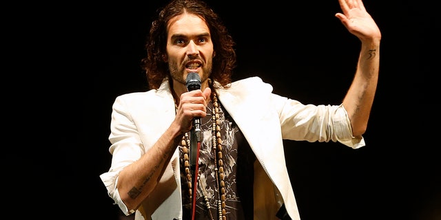 March 9, 2014. British comedian Russell Brand performs at his Messiah Complex show at Brixton Academy in London.