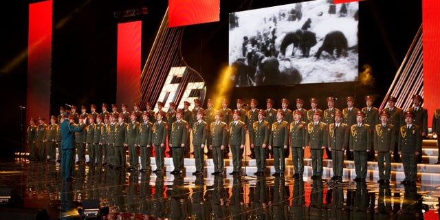 In this photo taken on Thursday, March 31, 2016, the Alexandrov Ensemble choir performs during a concert in Moscow, Russia. A Russian plane with 92 people aboard, including the well-known military band, crashed into the Black Sea on its way to Syria on Sunday, Dec. 25, minutes after takeoff from the resort city of Sochi, the Defense Ministry said. The Tu-154, which belonged to the ministry, was taking the Alexandrov Ensemble to a concert at the Russian air base in Syria. (AP Photo)