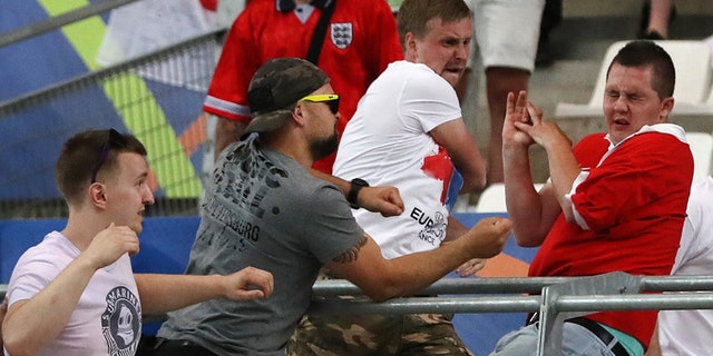 June 11, 2016: Russian supporters attack an England fan at the end of the Euro 2016 Group B soccer match between England and Russia, at the Velodrome stadium in Marseille, France.