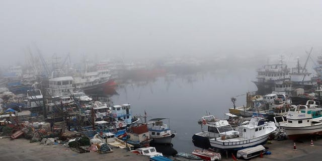 Boats seen in the fog-covered Rumelifeneri village port at the Black Sea on Thursday, the same day a Russian ship sank off the coast.