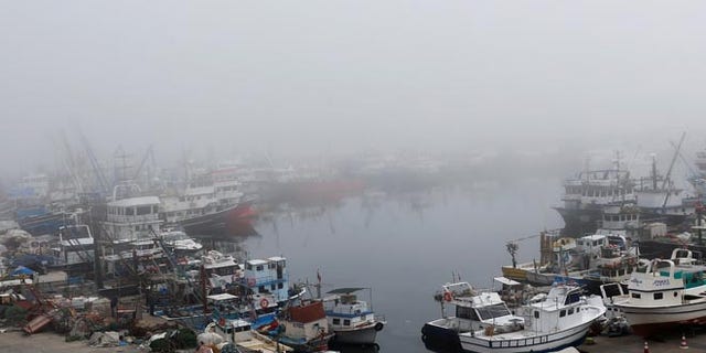 Boats seen in the fog-covered Rumelifeneri village port at the Black Sea on Thursday, the same day a Russian ship sank off the coast.
