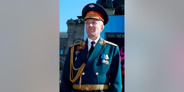 Valery Khalilov, the conductor and head of the Alexandrov choir, stands during the Victory Day military parade in Red Square in 2014.