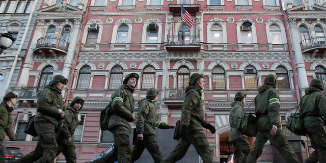 Military cadets walk past the U.S. consulate in St.Petersburg, Russia, March 31, 2018.