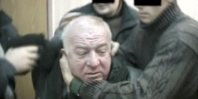A still image taken from an undated video shows Sergei Skripal, a former colonel of Russia's GRU military intelligence service, being detained by secret service officers in an unknown location.