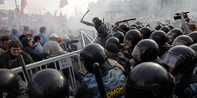 Sunday, May 6: Russian riot police disperse opposition protesters in downtown Moscow.