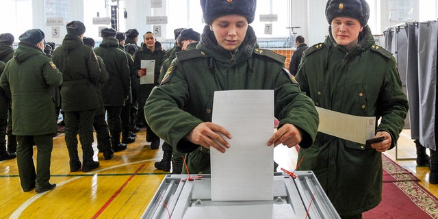 Russians vote during the presidential election on March 18, 2018.