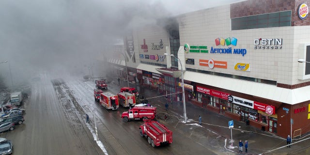 In this Russian Emergency Situations Ministry photo on Sunday, March 25, 2018, smoke rises above a multi-story shopping center in the Siberian city of Kemerovo, about 1,900 miles east of Moscow, Russia.