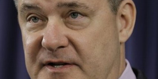 Illinois State Treasurer Dan Rutherford speaks with reporters at the Illinois State Capitol in Springfield Jan. 11.