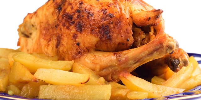 Roasted chicken against white background