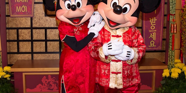 Mickey Mouse and Minnie Mouse are dressed in red for a Lunar New Year celebration at Disney California Adventure Park in Anaheim, California, in January 2016.