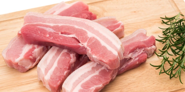 Raw pork belly slices - studio shot