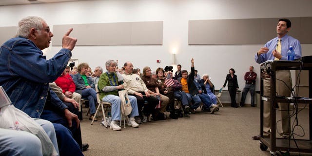 A man makes a point to U.S. Rep. Paul Ryan, R-Wis., right, as he speaks during a listening session Tuesday, April, 26, 2011 at Gateway Technical College in Kenosha, Wis. (AP)