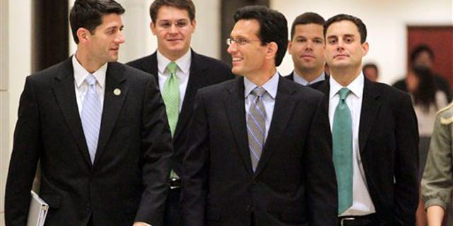 House Budget Committee Chairman Paul Ryan, left, and House Majority Leader Eric Cantor, center, and others walk to a news conference on Capitol Hill in Washington Aug. 1.