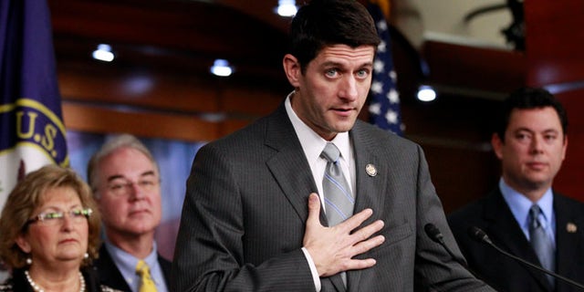 Dec. 7, 2011: House Budget Committee Chairman Rep. Paul Ryan, R-Wis., second from right, accompanied by fellow committee members, gestures during a news conference on Capitol Hill in Washington.
