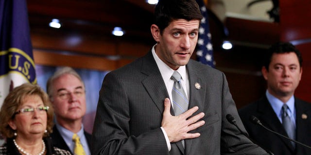 Dec. 7, 2011: House Budget Committee Chairman Rep. Paul Ryan, R-Wis., second from right, accompanied by fellow committee members, gestures during a news conference on Capitol Hill in Washington.