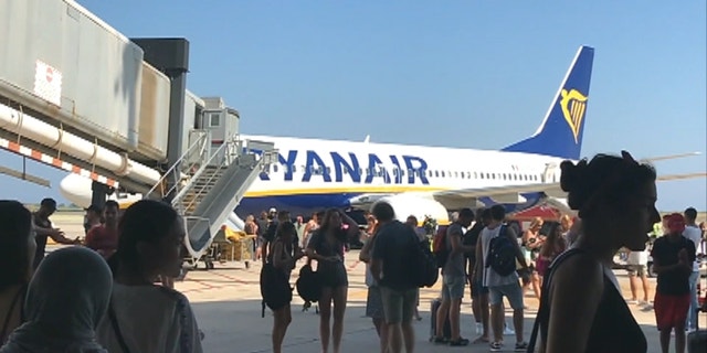 A Ryanair plane was evacuated on July 31 after a passenger's cell phone caught fire in the cabin.