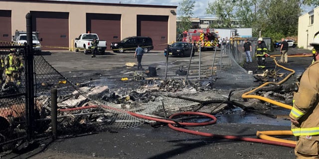 MAY 15: In this image provided by the Town of Carlstadt firefighters respond after a jet crashed into a building near Teterboro Airport in Carlstadt, N.J.