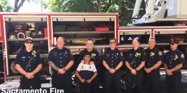 Saul Orejel, pictured with members of the Sacramento Fire Department, has dreamed of becoming a firefighter since he was a little boy.