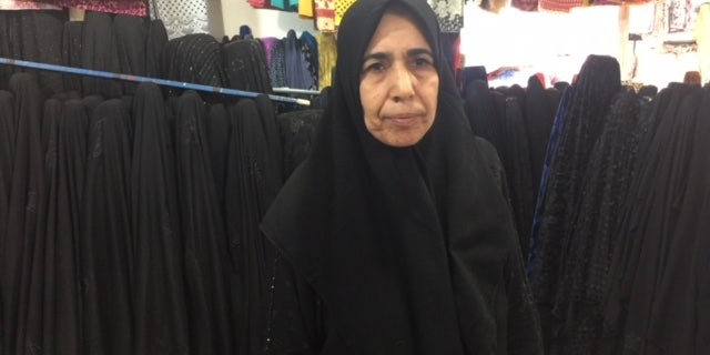 Inside Baghdad's once infamously violent, Sadr City: local fabric store owner, Saami