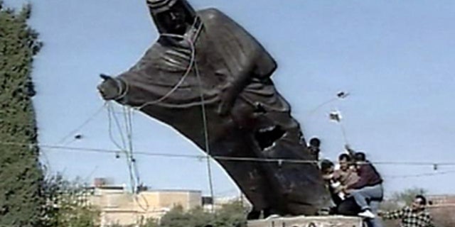 Kurds topple the statue of Saddam Hussein in Kirkuk, Northern Iraq in 2003.
