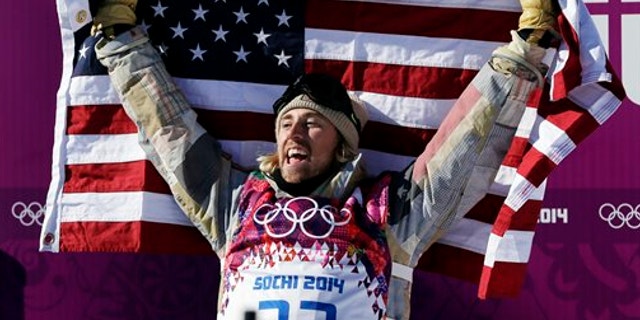 Feb. 8, 2014: United States' Sage Kotsenburg celebrates after winning the men's snowboard slopestyle final at the Rosa Khutor Extreme Park, at the 2014 Winter Olympics, in Krasnaya Polyana, Russia.