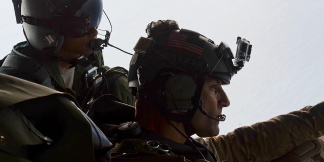 May 3, 2014: Airman 1st Class Franscisco Harper, left, and a pararescue airman survey the area as U.S. Air Force pararescue forces parachute into the Pacific Ocean to aid to two critically injured sailors aboard a Venezuelan fishing boat.