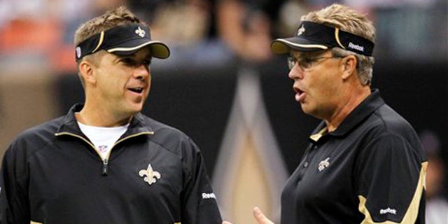 Sept. 26, 2010: In this file photo, New Orleans Saints head coach Sean Payton and defensive coordinator Gregg Williams talk during their NFL football game at the Louisiana Superdome in New Orleans, La.
