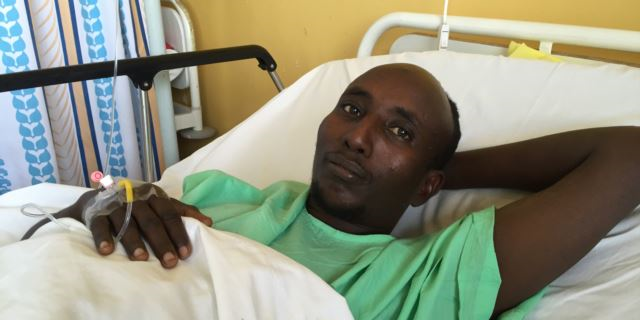 Salah Farah was shot when the bus he was traveling in was attacked by al-Shabaab militants in December 2015. (J. Craig/VOA)
