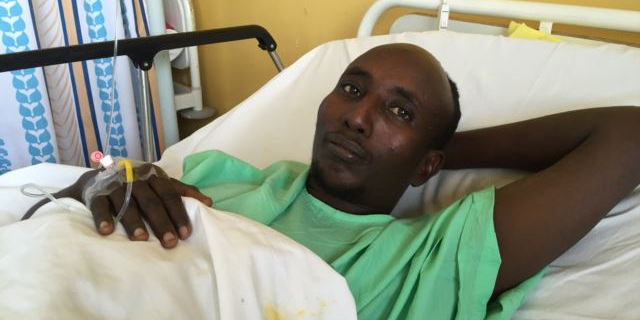Salah Farah was shot when the bus he was traveling in was attacked by al-Shabaab militants in December 2015. (J. Craig/VOA)
