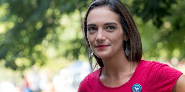 In this Aug. 15, 2018 file photo, Democratic New York state Senate candidate Julia Salazar smiles as she speaks to a supporter before a rally in McCarren Park in Brooklyn. Salazer said Sep. 11 that she was sexually assaulted five years ago by David Keyes , a spokesman for Israeli Prime Minister Benjamin Netanyahu, an accusation he denies. (AP Photo/Mary Altaffer, File)