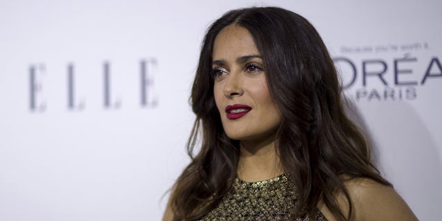 October 19, 2015. Actress Salma Hayek poses at the 22nd annual ELLE Women in Hollywood Awards in Los Angeles, California.