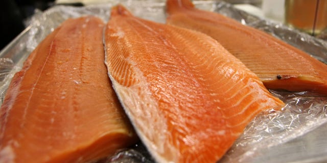 SAN FRANCISCO - APRIL 11: Fresh wild and farmed Loch Duart salmon filets are seen on a tray at the San Francisco Fish Company April 11, 2008 in San Francisco, California. The Pacific Fishery Management Council voted Thursday afternoon to cancel the chinook fishing season along the coast of California and Oregon in hopes of reversing the dwindling numbers of salmon. Farmed salmon will be a popular replacement for fresh wild salmon on seafood store shelves during the fishing ban. (Photo by Justin Sullivan/Getty Images)