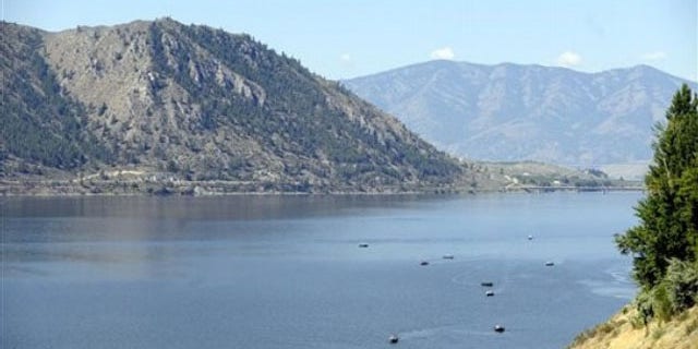 Salmon fishermen troll along the banks of a stretch of the Columbia River near Brewster, Wash. on July 22, 2010.