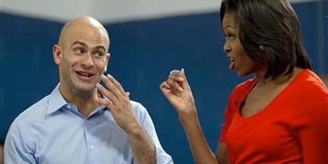 FILE: House assistant chef Sam Kass, who cooks dinner for President Barack Obama several nights a week, with First Lady Michelle Obama.