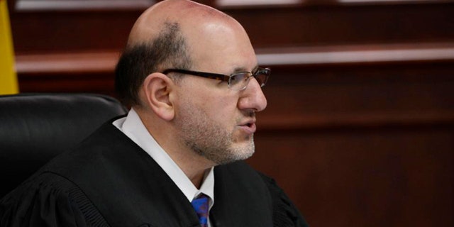 FILE - In this June 4, 2013, file photo, Judge Carlos A. Samour Jr. speaks during a hearing for Aurora theater shooting suspect James Holmes in Centennial, Colo. Samour became a district court judge in 2007 after working as a private defense attorney, then a Denver prosecutor. The Holmes trial is Samours first death penalty case. (AP Photo/The Denver Post, Andy Cross, Pool, File)