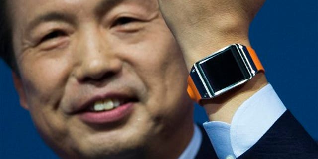 JK Shin, head of Samsung Mobile Communications, presents the Samsung Galaxy Gear in Berlin, Germany, Wednesday, Sept. 4, 2013.