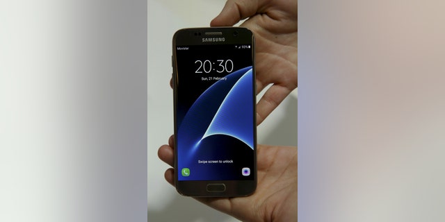 The new Samsung S7 smartphone is displayed after its unveiling ceremony at the Mobile World Congress in Barcelona, Spain, Feb. 21, 2016. (REUTERS/Albert Gea)