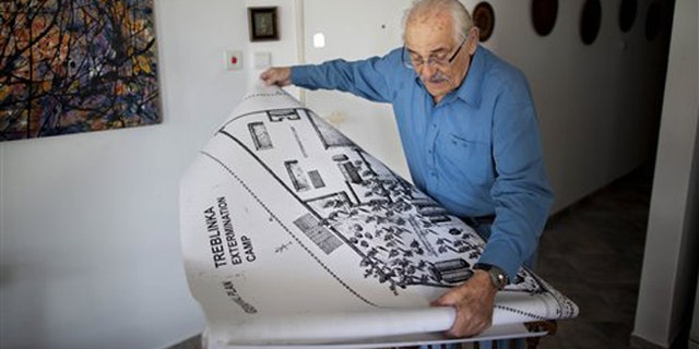 Holocaust survivor Samuel Willenberg displays a map of Treblinka extermination camp during an interview with the Associated Press at his house in Tel Aviv, Israel, Sunday, Oct. 31, 2010. (AP)