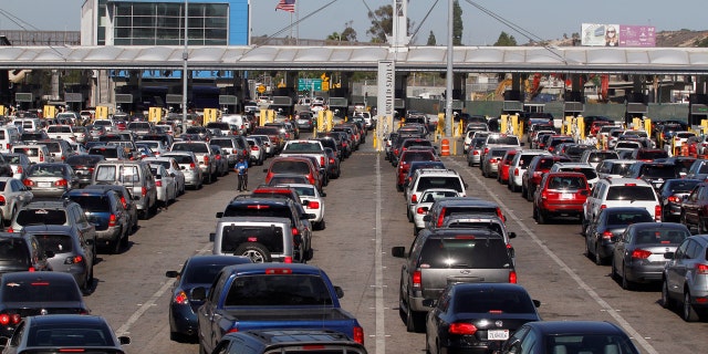 Cars stand in multiple lines as they wait to be inspected by U.S. border patrol officers to enter from Mexico to the U.S., at the San Ysidro point of entry, in Tijuana, Mexico.