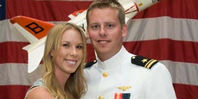 January 2, 2011: This photo provided by the Reis family shows Karen Reis, left, and her brother David Reis at his winging ceremony for the Navy.