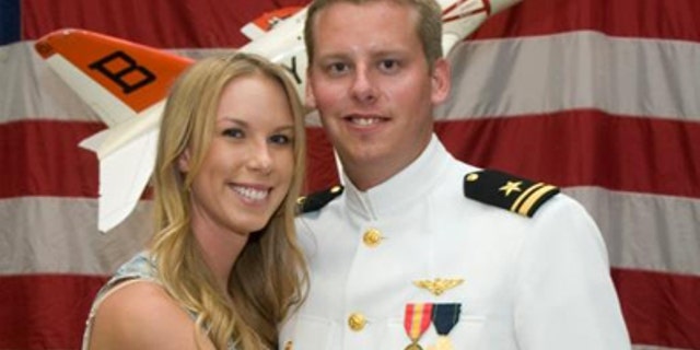 January 2, 2011: This photo provided by the Reis family shows Karen Reis, left, and her brother David Reis at his winging ceremony for the Navy.